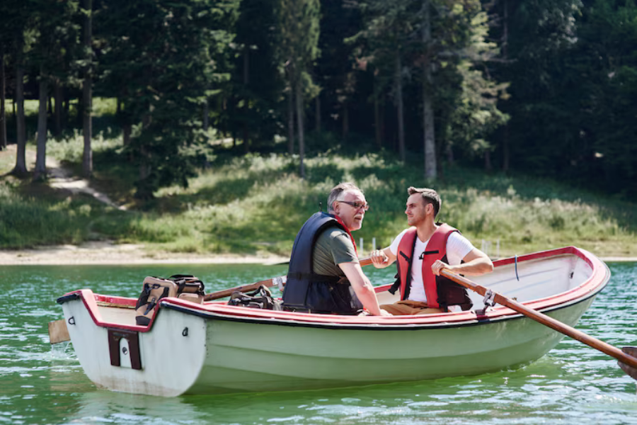 Two people canoeing on a river 